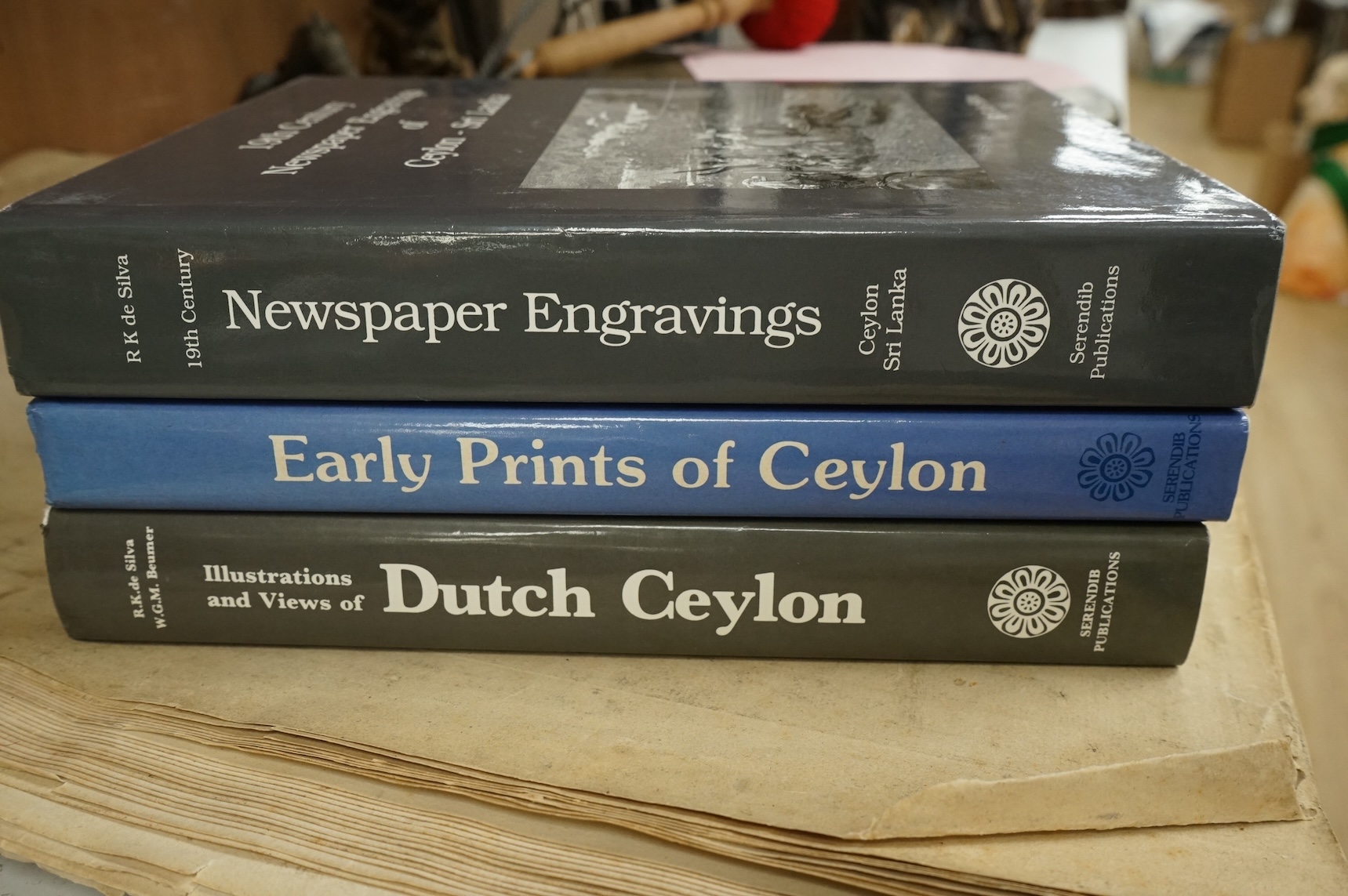 Silva, R.K. de - Early Prints of Ceylon ... 1800-1900. coloured frontis, many coloured and other illus. (some full page); publisher's cloth and d/wrapper, roy.4to. Serendib Publications, 1985; Silva, R.K. de and Beumer,